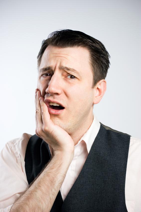 Man holding jaw in pain | Dentist Duxbury MA